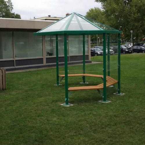 Meetingpoint - rokersoverkapping Paris 51 Moderne rookoverkapping - rokerspaviljoen met glazen dak en glazen wanden in bedrijfstuin met zitbanken